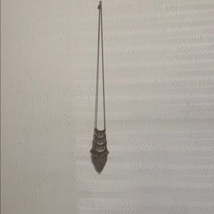 Golden drop tier necklace.